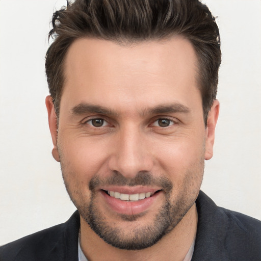 Joyful white young-adult male with short  brown hair and brown eyes