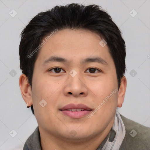 Joyful asian young-adult male with short  brown hair and brown eyes