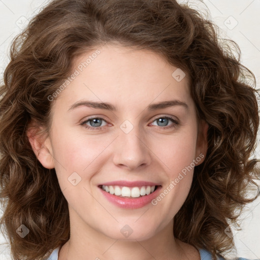 Joyful white young-adult female with long  brown hair and green eyes