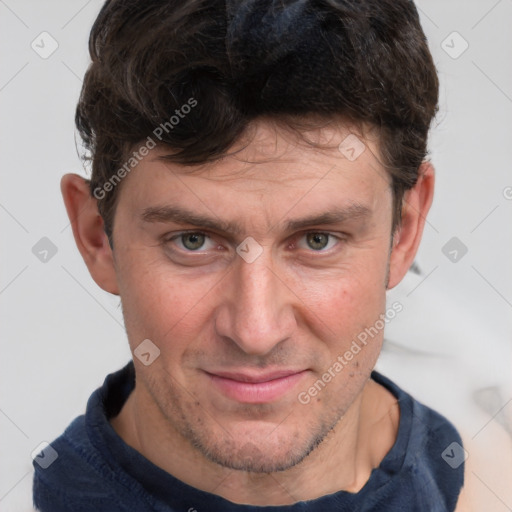 Joyful white adult male with short  brown hair and grey eyes