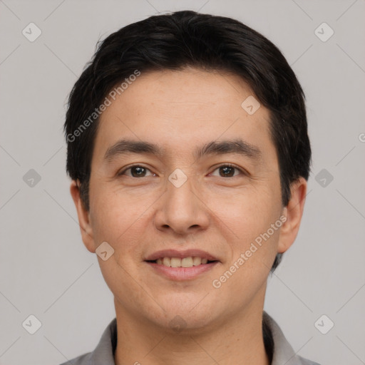 Joyful white young-adult male with short  black hair and brown eyes