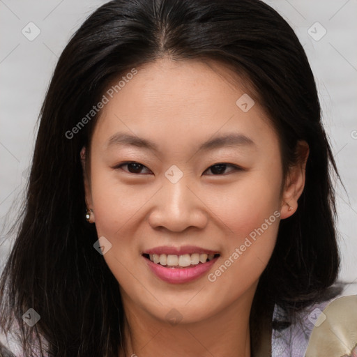 Joyful asian young-adult female with long  brown hair and brown eyes