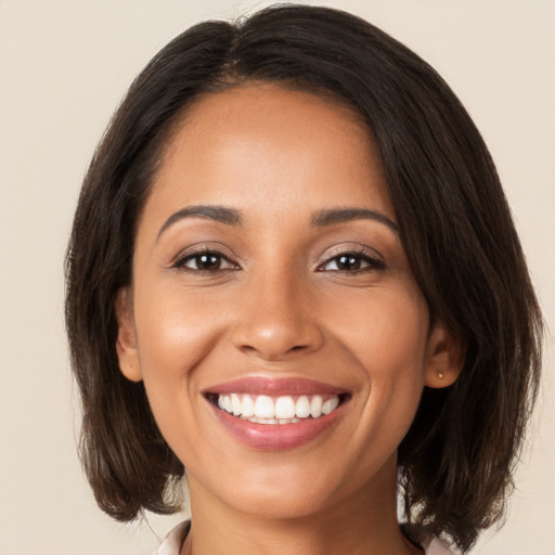 Joyful white young-adult female with medium  brown hair and brown eyes