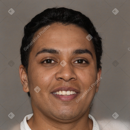 Joyful latino young-adult male with short  brown hair and brown eyes