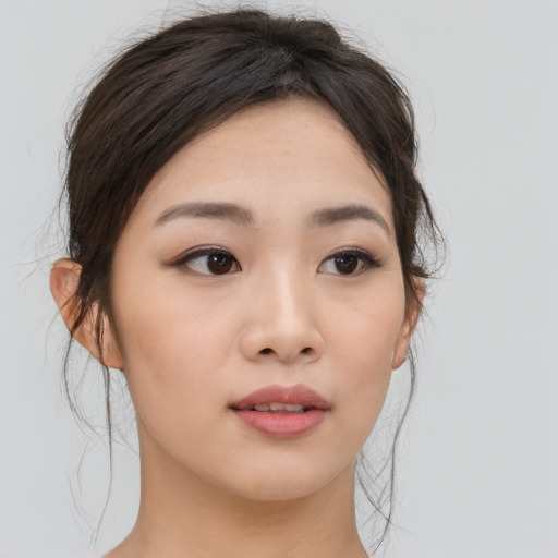 Neutral asian young-adult female with medium  brown hair and brown eyes