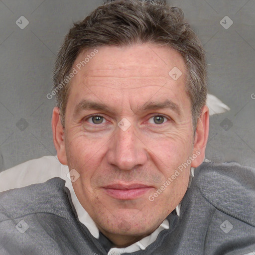 Joyful white adult male with short  brown hair and grey eyes