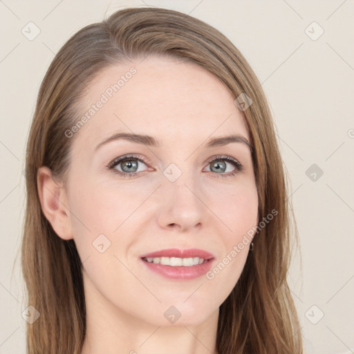 Joyful white young-adult female with long  brown hair and grey eyes