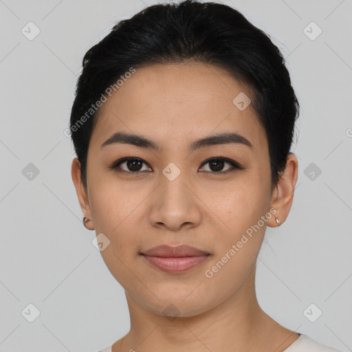 Joyful asian young-adult female with short  black hair and brown eyes