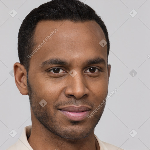 Joyful black young-adult male with short  brown hair and brown eyes