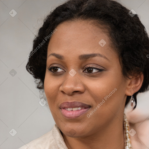 Joyful black young-adult female with medium  brown hair and brown eyes