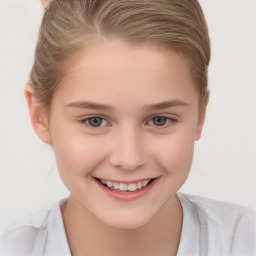 Joyful white child female with short  brown hair and brown eyes