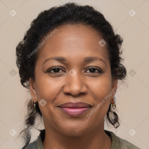 Joyful black adult female with medium  brown hair and brown eyes