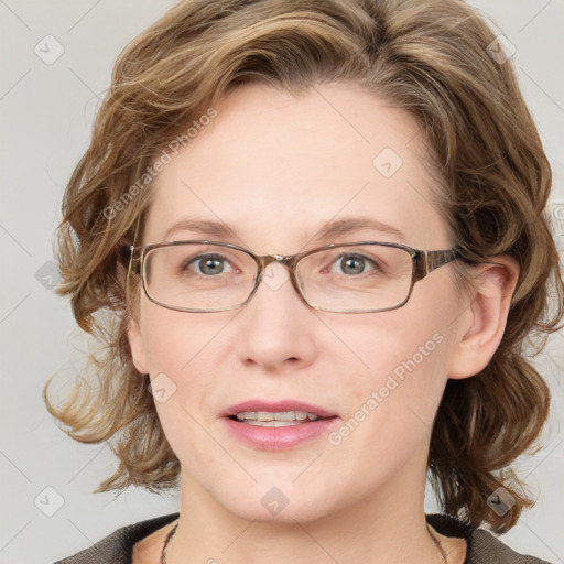 Joyful white adult female with medium  brown hair and blue eyes