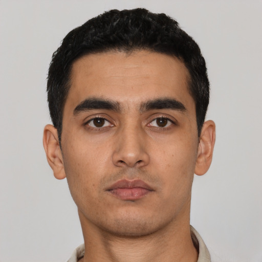 Neutral latino young-adult male with short  black hair and brown eyes