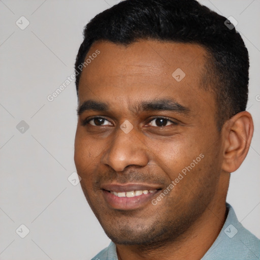 Joyful black young-adult male with short  black hair and brown eyes