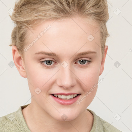 Joyful white young-adult female with short  brown hair and blue eyes