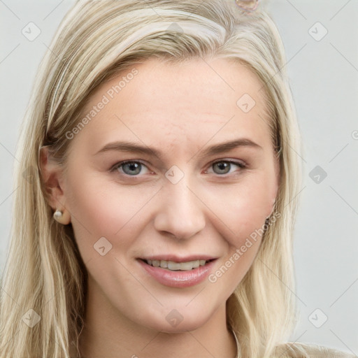 Joyful white young-adult female with long  brown hair and blue eyes