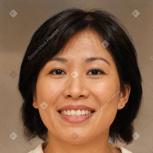 Joyful white adult female with medium  brown hair and brown eyes