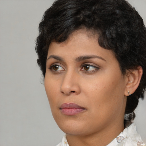 Neutral latino young-adult female with short  brown hair and brown eyes