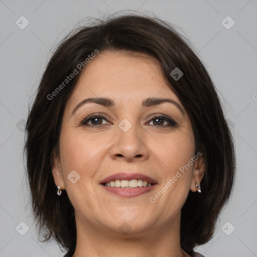 Joyful white adult female with medium  brown hair and brown eyes