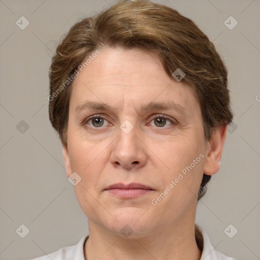 Joyful white adult female with short  brown hair and grey eyes