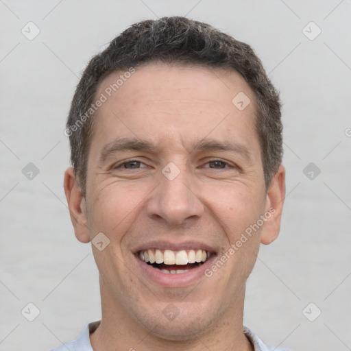 Joyful white adult male with short  brown hair and brown eyes