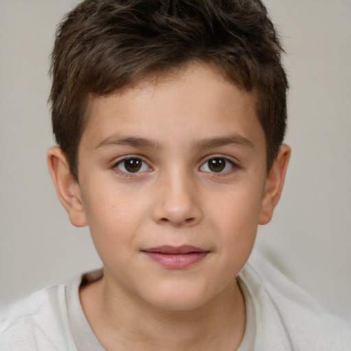 Joyful white child male with short  brown hair and brown eyes