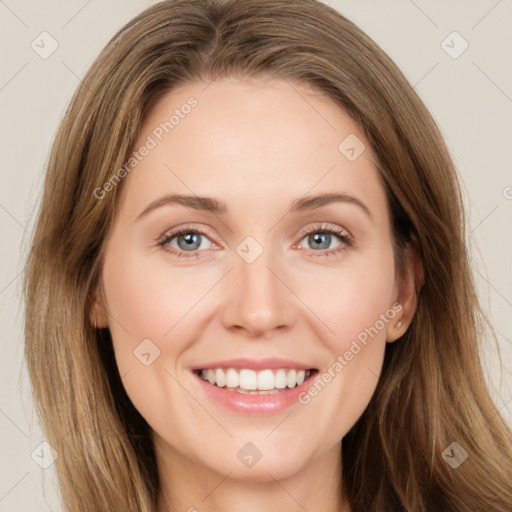 Joyful white young-adult female with long  brown hair and green eyes