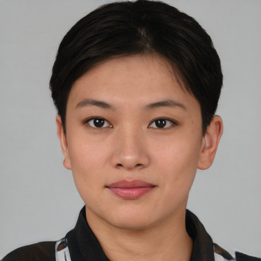 Joyful asian young-adult female with short  black hair and brown eyes