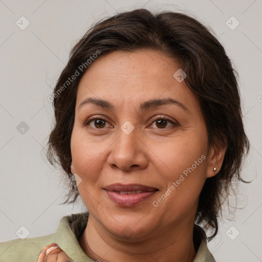 Joyful white adult female with medium  brown hair and brown eyes