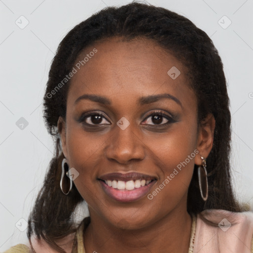 Joyful black young-adult female with long  brown hair and brown eyes