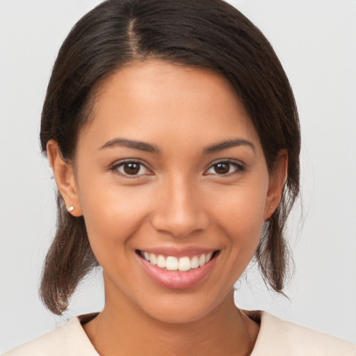 Joyful white young-adult female with medium  brown hair and brown eyes