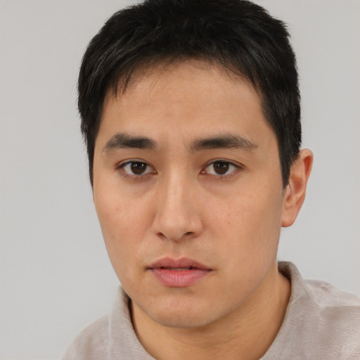 Neutral asian young-adult male with short  brown hair and brown eyes