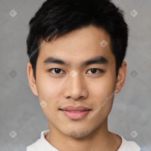 Joyful asian young-adult male with short  black hair and brown eyes