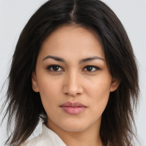 Neutral latino young-adult female with long  brown hair and brown eyes