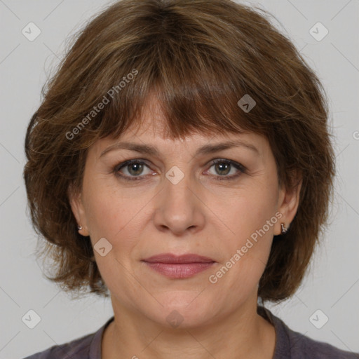 Joyful white adult female with medium  brown hair and grey eyes