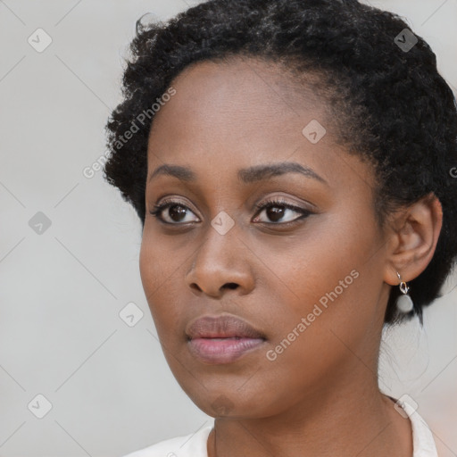 Neutral black young-adult female with short  black hair and brown eyes