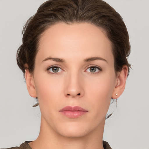 Neutral white young-adult female with short  brown hair and brown eyes