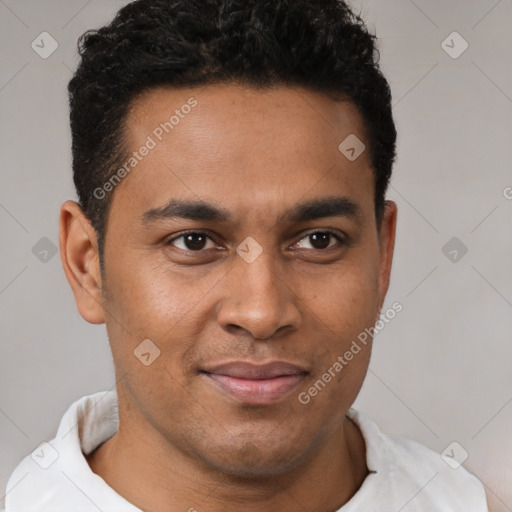 Joyful latino young-adult male with short  brown hair and brown eyes