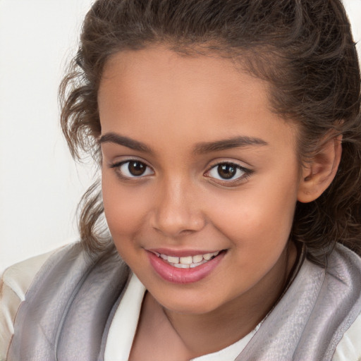 Joyful white child female with long  brown hair and brown eyes