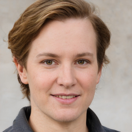 Joyful white adult female with medium  brown hair and blue eyes