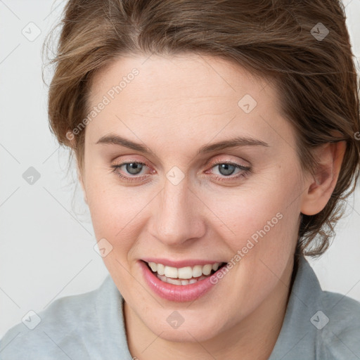 Joyful white young-adult female with medium  brown hair and blue eyes