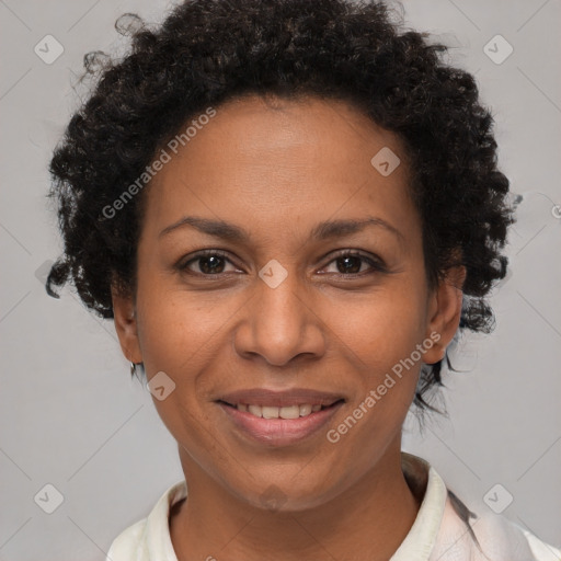 Joyful black adult female with short  brown hair and brown eyes