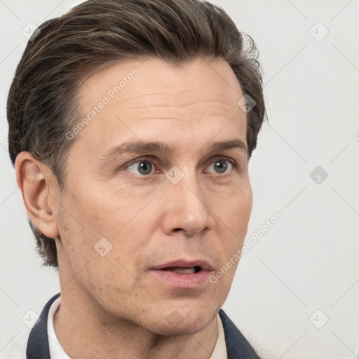 Neutral white adult male with short  brown hair and brown eyes