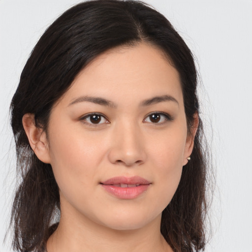Joyful asian young-adult female with long  brown hair and brown eyes