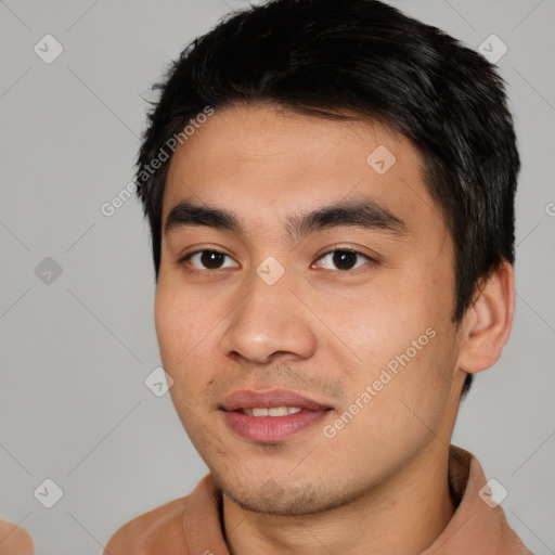 Joyful asian young-adult male with short  brown hair and brown eyes