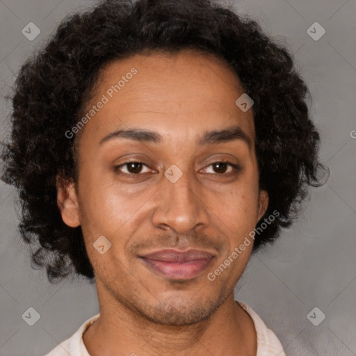 Joyful latino adult male with short  brown hair and brown eyes