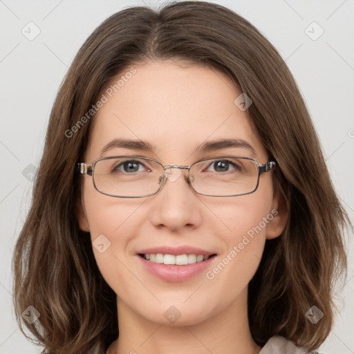 Joyful white young-adult female with long  brown hair and green eyes