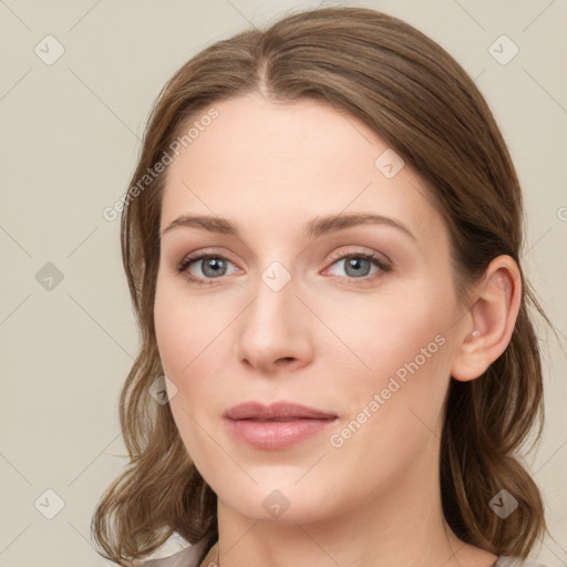 Joyful white young-adult female with medium  brown hair and green eyes