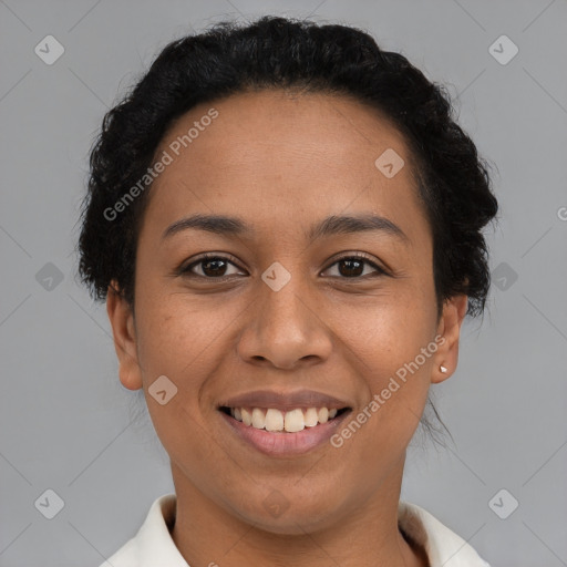 Joyful latino young-adult female with short  brown hair and brown eyes